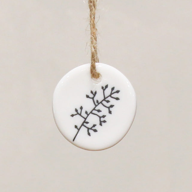 Reverse of the porcelain gift tag is a hand drawn floral sprig